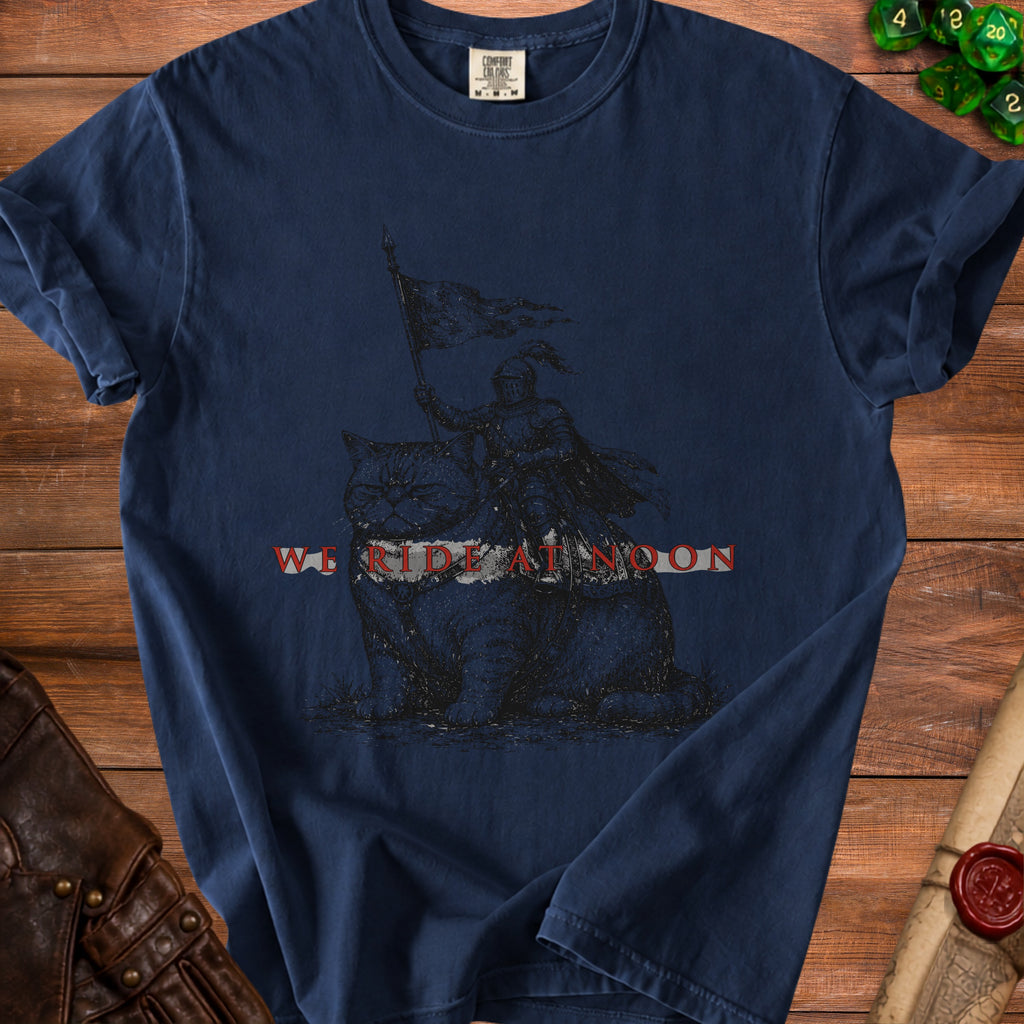 Navy t-shirt with a knight riding a cat graphic and "WE RIDE AT NOON" text.