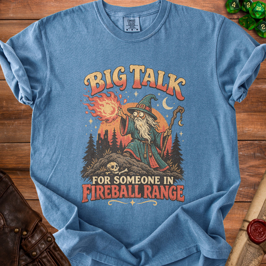 Blue t-shirt with wizard graphic and "Big Talk For Someone In Fireball Range" text.