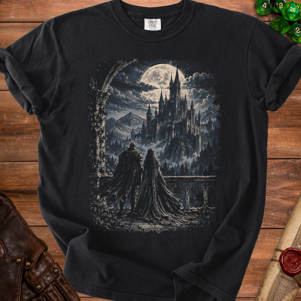 Black t-shirt featuring a gothic castle under a full moon with two cloaked figures.