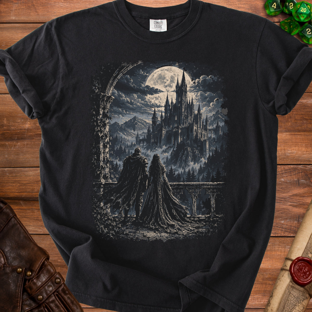 Black t-shirt featuring a gothic castle under a full moon with two cloaked figures.