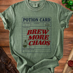 Green t-shirt with "POTION CARD BREW MORE CHAOS" graphic and dice.