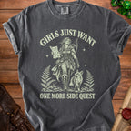 Dark grey t-shirt with "Girls Just Want One More Side Quest" text and fantasy illustration.