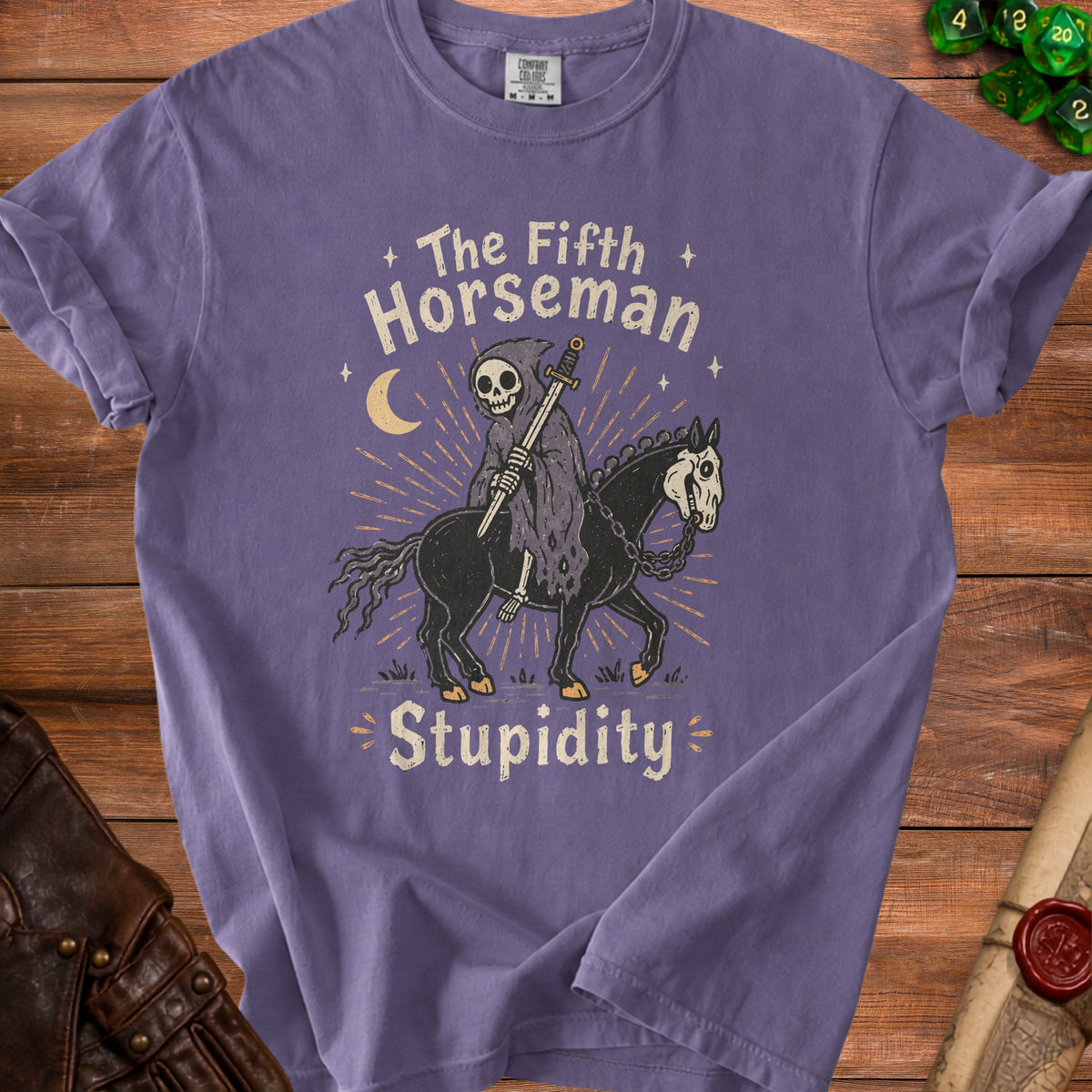 Purple t-shirt with Grim Reaper riding horse, reading "The Fifth Horseman Stupidity".