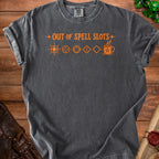 Dark gray t-shirt with orange text "Out of Spell Slots" and gaming symbols.