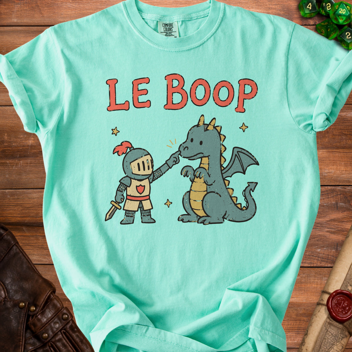 Light blue t-shirt with cartoon knight poking dragon and "LE BOOP" text.