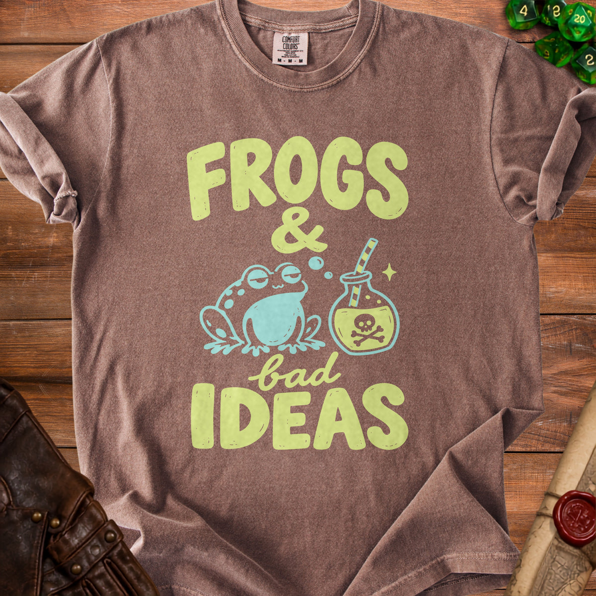 Brown t-shirt with "Frogs & Bad Ideas" text and frog illustration.