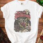 White t-shirt with "Roll For Bad Decisions" graphic featuring a cat, dice, and skull.