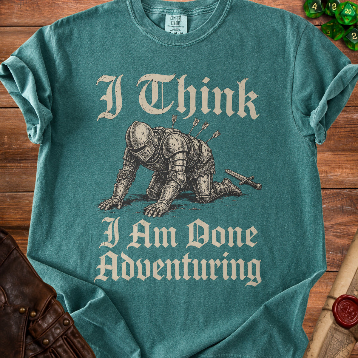 Teal t-shirt with knight graphic and text "I Think I Am Done Adventuring".