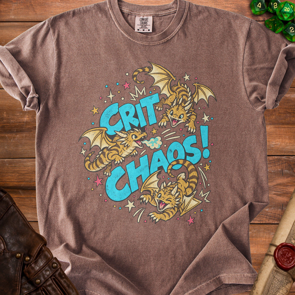 Brown t-shirt with "Crit Chaos!" text and three cartoon dragons.
