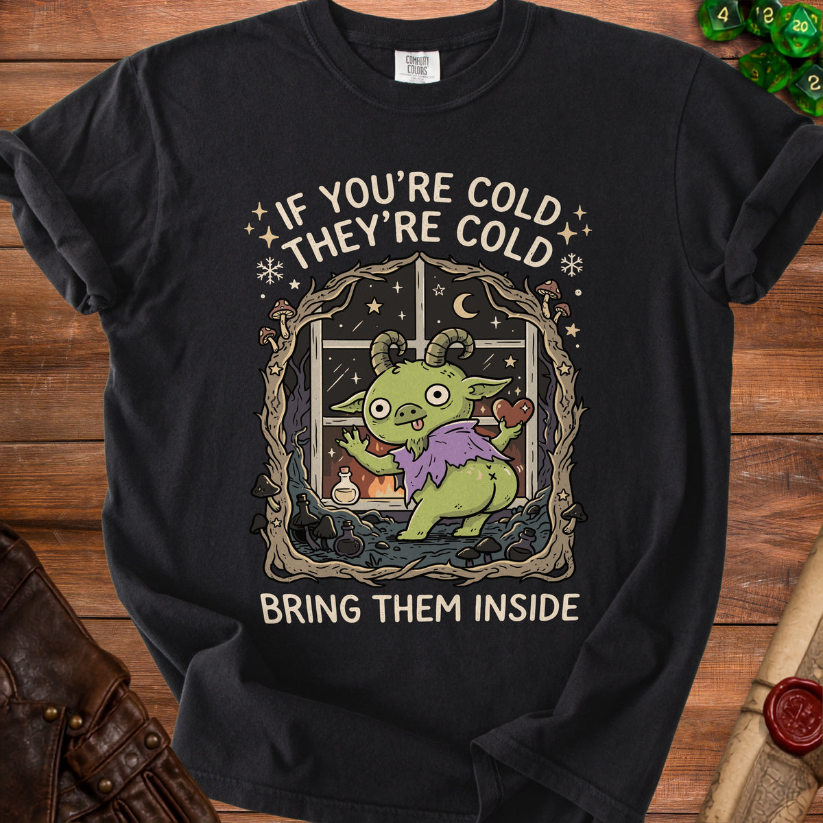 Black t-shirt with green goblin art and text "If you're cold they're cold bring them inside".