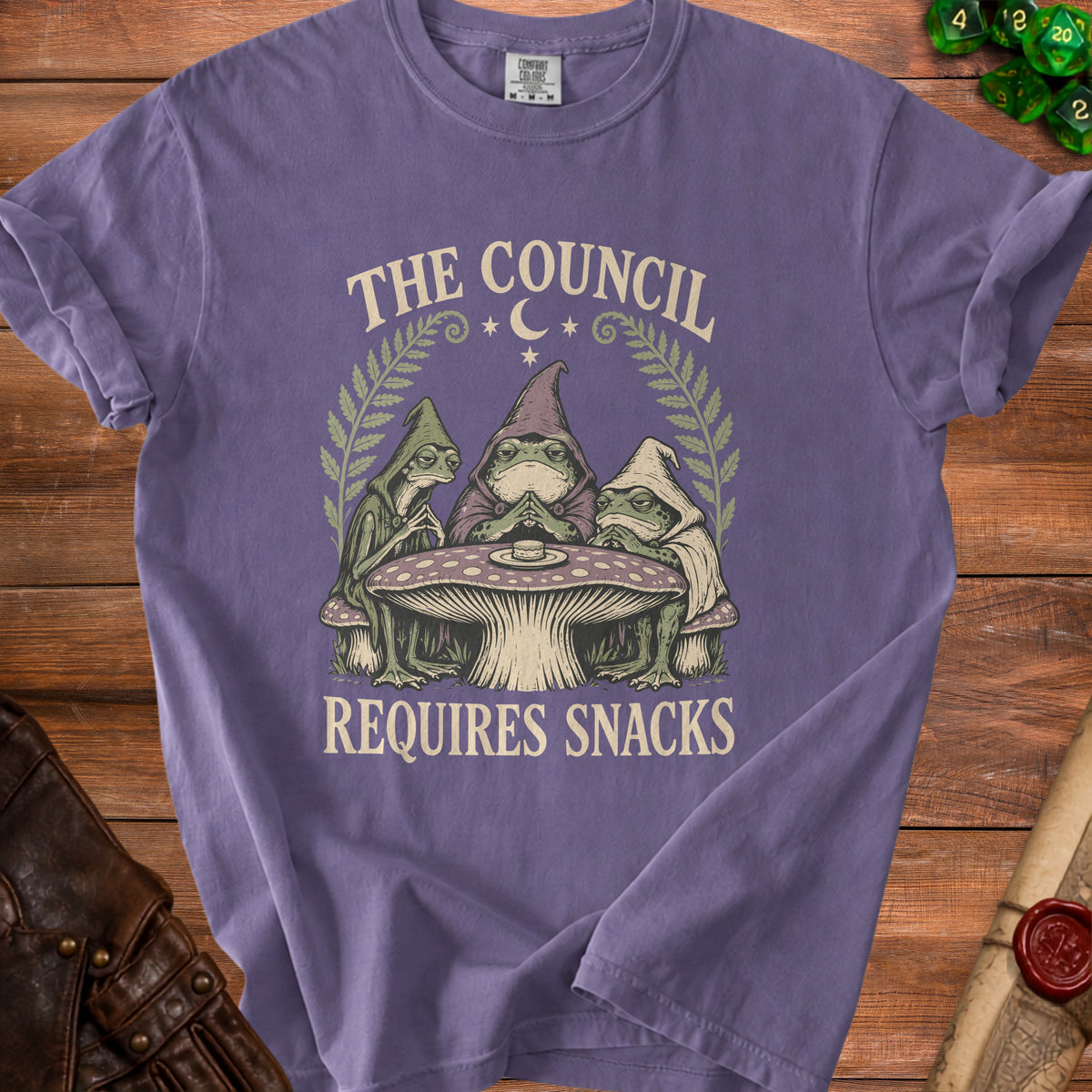Purple t-shirt with "The Council Requires Snacks" graphic featuring toads.