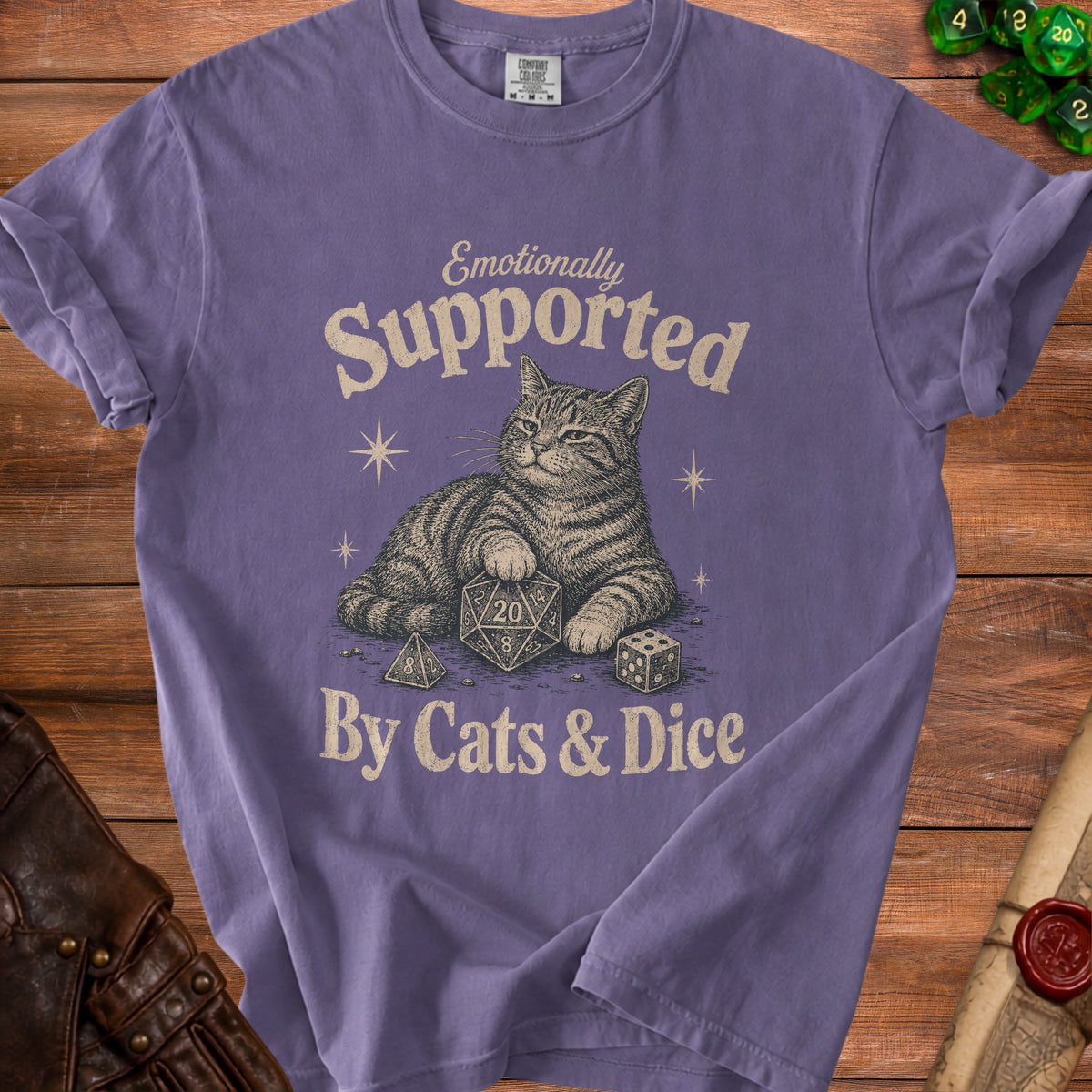 Purple t-shirt with cat and dice graphic saying "Emotionally Supported By Cats & Dice".