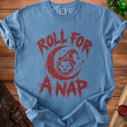 Blue t-shirt with red graphic of dice, moon, and text "ROLL FOR ANAP".