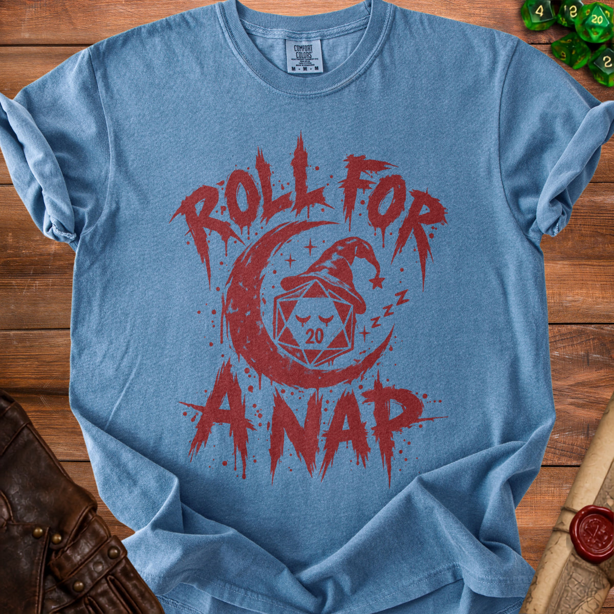 Blue t-shirt with red graphic of dice, moon, and text "ROLL FOR ANAP".