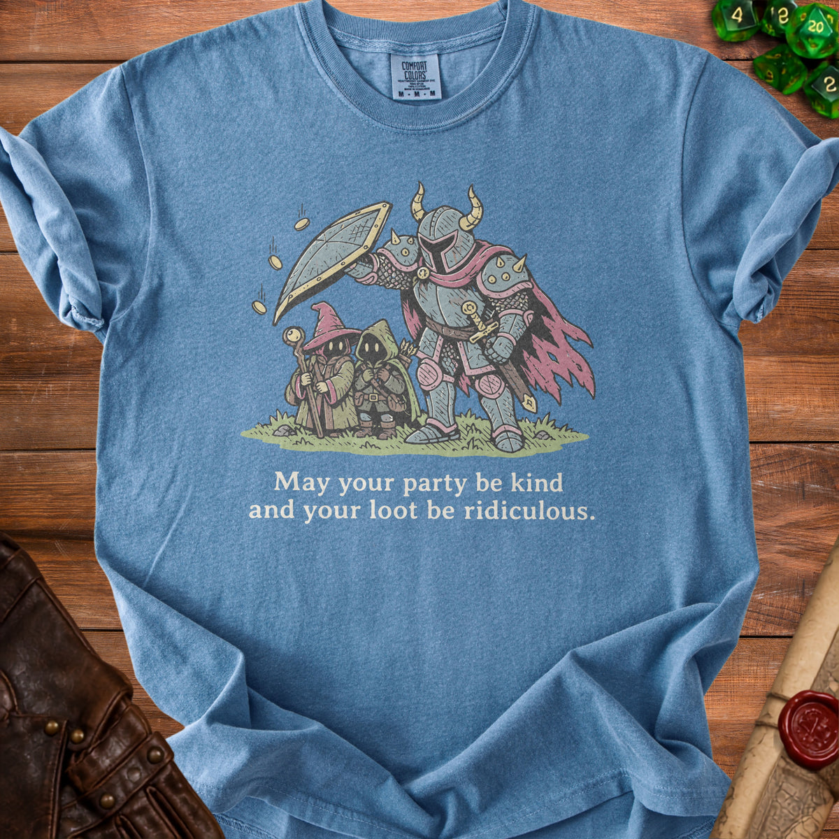 Blue t-shirt featuring an illustration of fantasy roleplaying adventurers and the text May your party be kind and your loot be ridiculous.