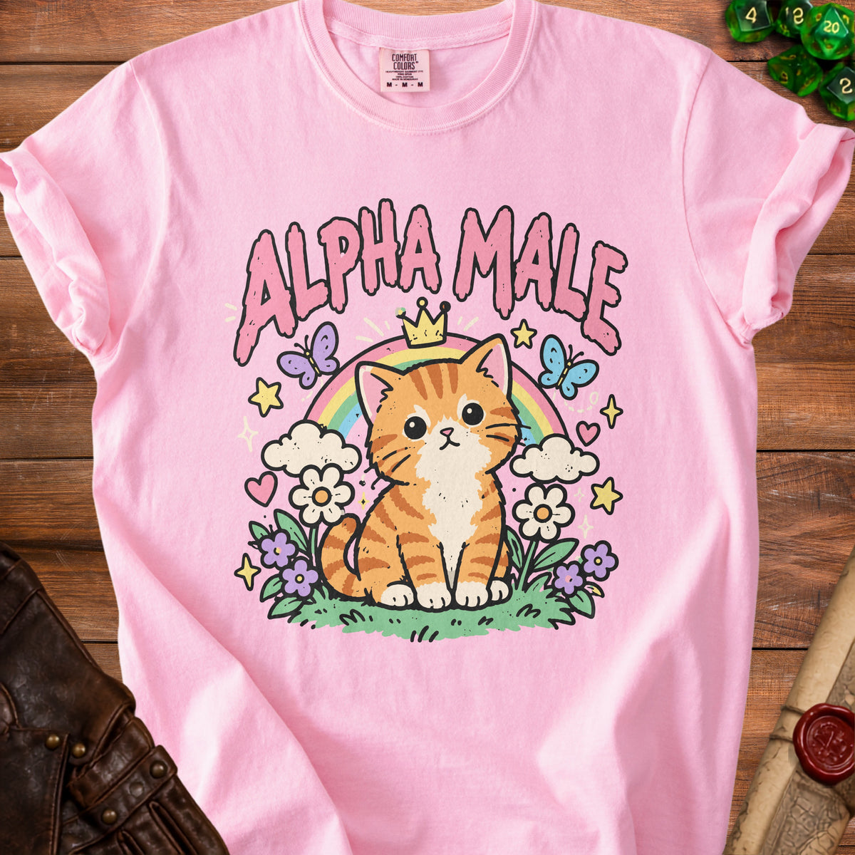 Pink t-shirt with a cute cartoon cat wearing a crown and the text "ALPHA MALE".