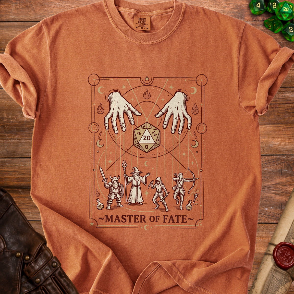 T-shirt with "Master of Fate" text, dice, fantasy characters, and hands.