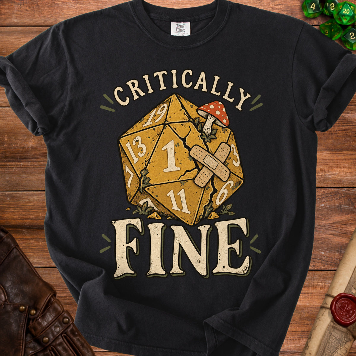 Black t-shirt with dice graphic reading "Critically Fine" and a mushroom.