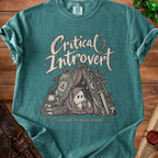 Teal t-shirt with "Critical Introvert" graphic, featuring a ghost in a tent holding a D20 die.