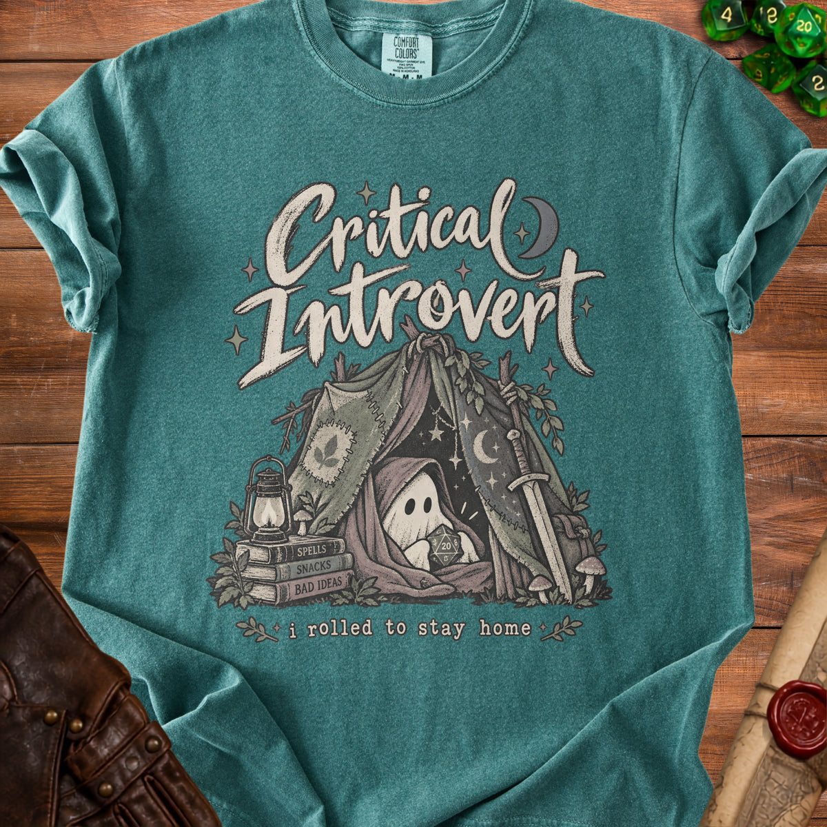 Teal t-shirt with "Critical Introvert" graphic, featuring a ghost in a tent holding a D20 die.