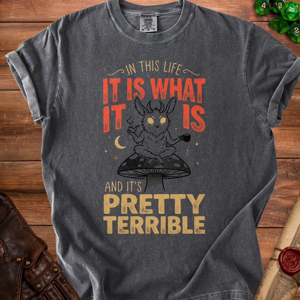 Dark grey t-shirt with illustration of a horned creature sitting on a mushroom, holding a pipe and a mug.