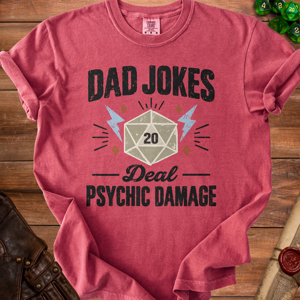 Red shirt with "Dad Jokes Deal Psychic Damage" text and a D20 die.