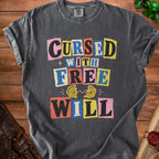 Dark gray t-shirt with "Cursed With Free Will" text and broken compass graphic.