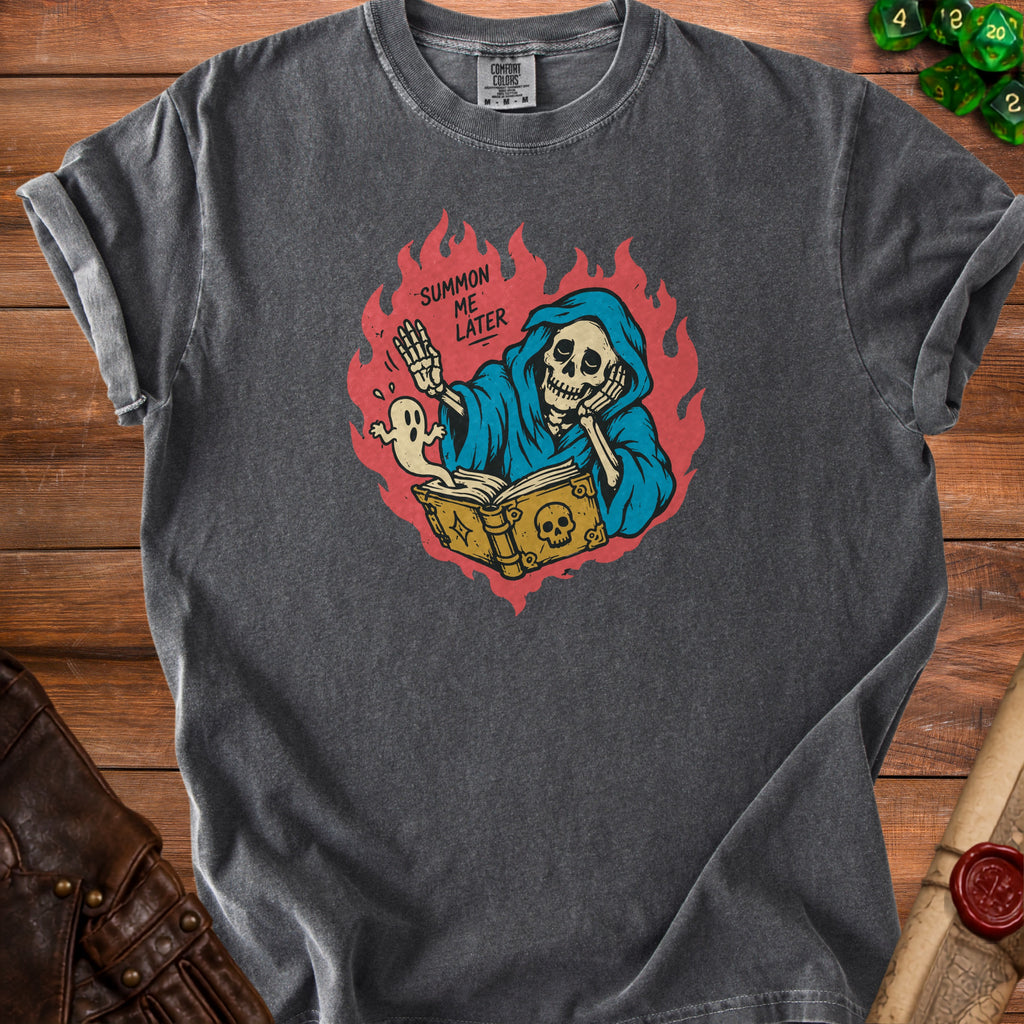 Gray t-shirt with grim reaper reading a book and ghost, text "SUMMON ME LATER".
