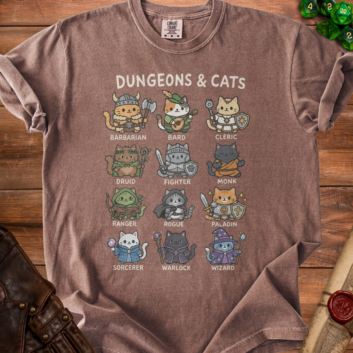 Brown t-shirt with "Dungeons & Cats" and illustrations of cats in RPG class costumes.