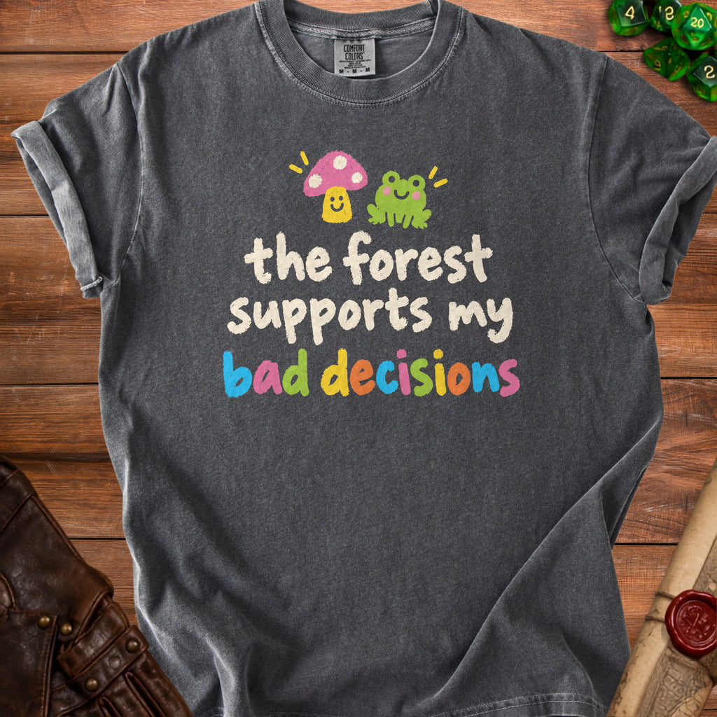 Dark gray t-shirt with text "the forest supports my bad decisions" and cute mushroom and frog graphics.
