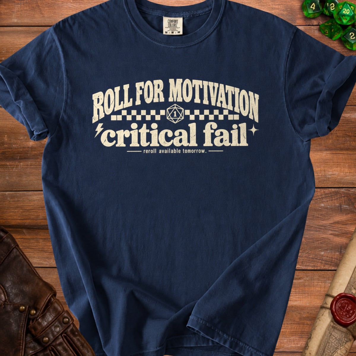 Navy t-shirt with "Roll for Motivation Critical Fail" text and dice graphic.