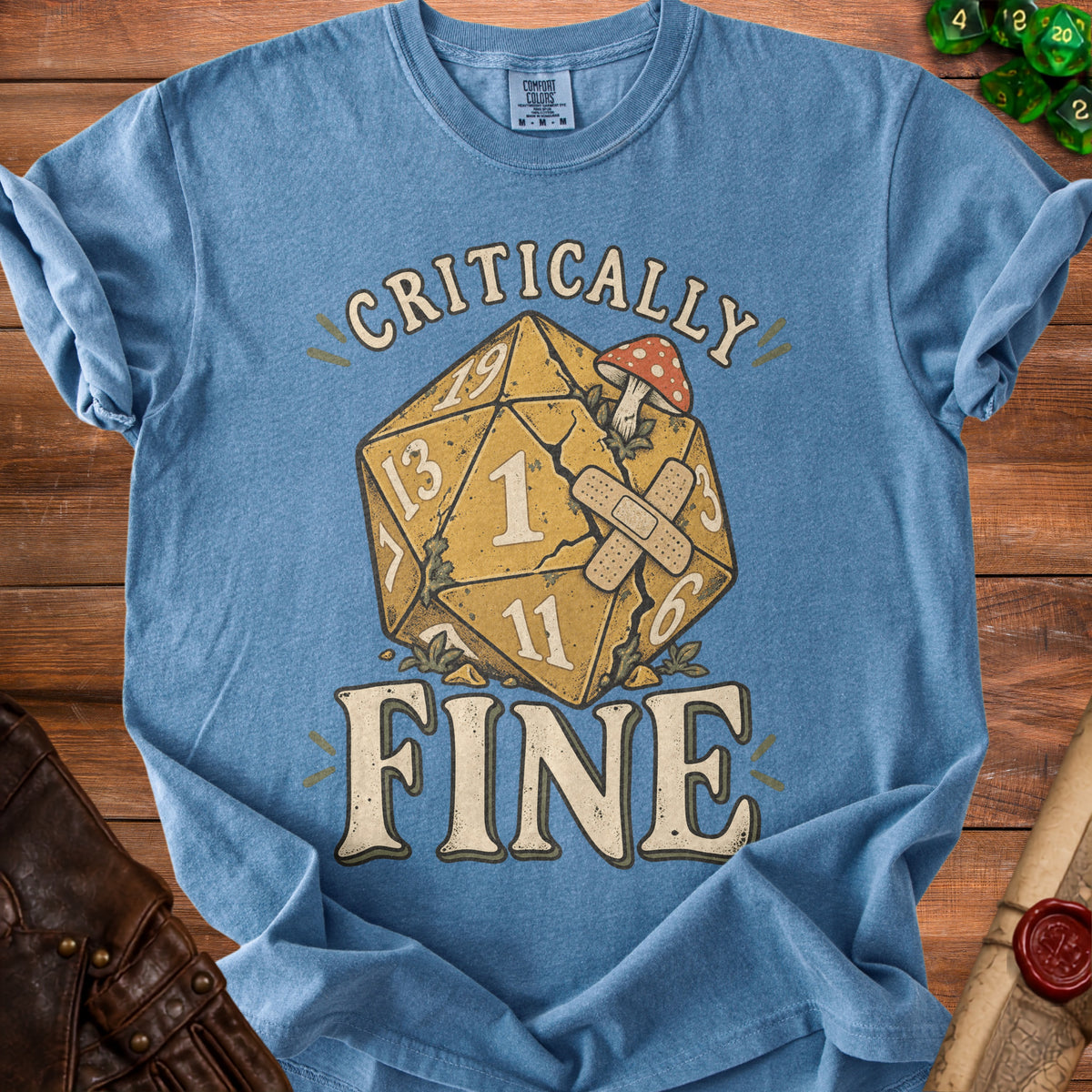 Blue t-shirt with "Critically Fine" text and a damaged D20 die.