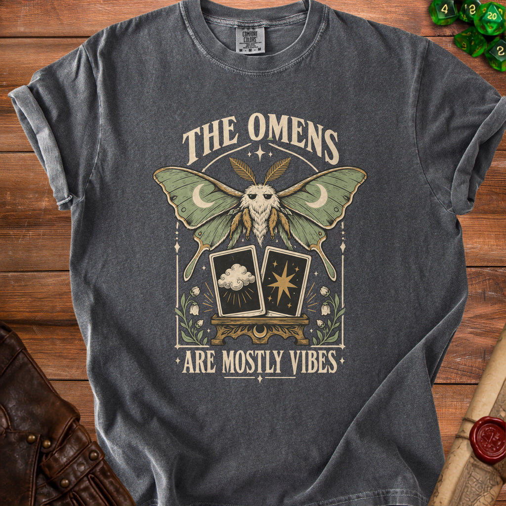Dark grey t-shirt with a moth, tarot cards, and text "The Omens Are Mostly Vibes".