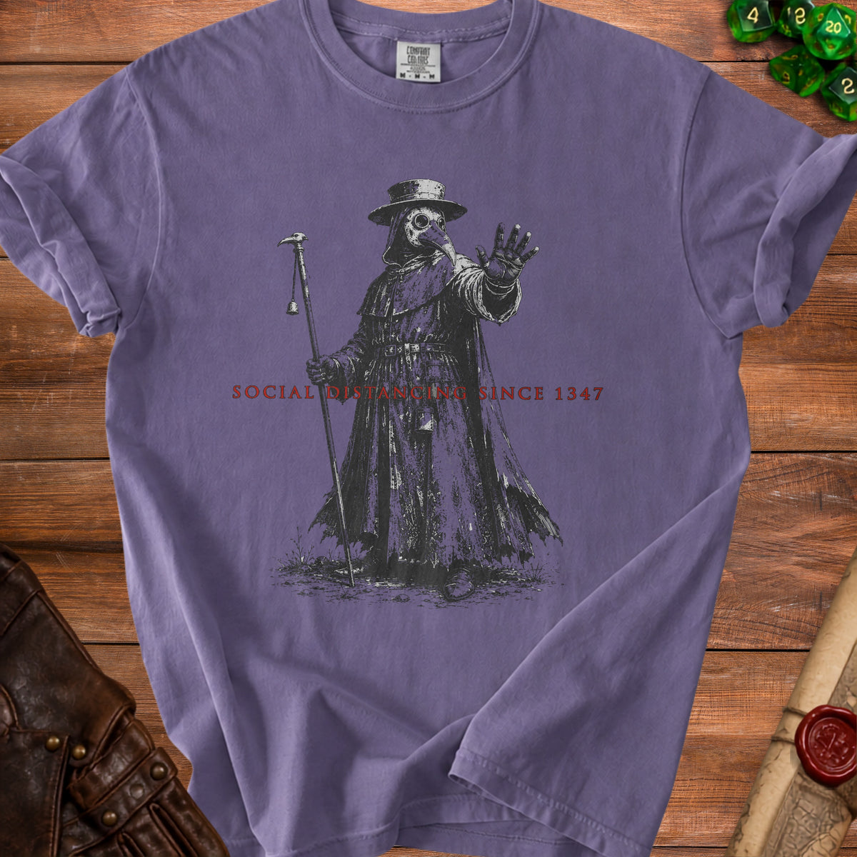 Plague doctor illustration on a purple t-shirt with "Social Distancing Since 1347".