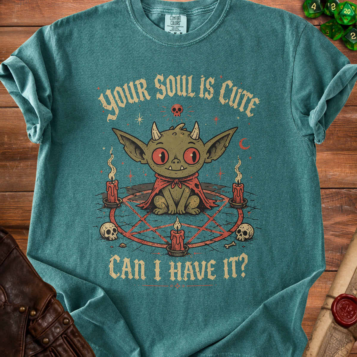 Teal t-shirt with a cute demon graphic and text: "YOUR SOUL IS CUTE CAN I HAVE IT?"