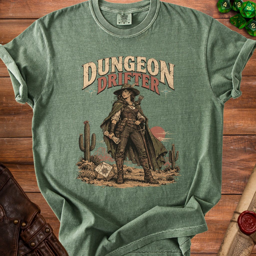 A green t-shirt featuring a western-style fantasy illustration with text reading Dungeon Drifter.
