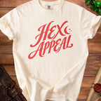 Cream t-shirt with red "Hex Appeal" graphic and a scroll and dice.