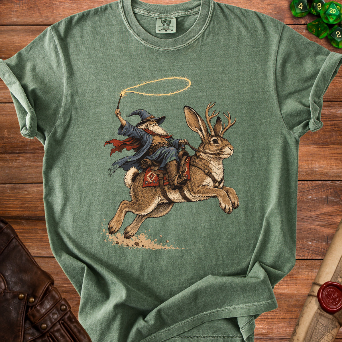 Wizard riding jackalope with lasso and wand on green t-shirt.