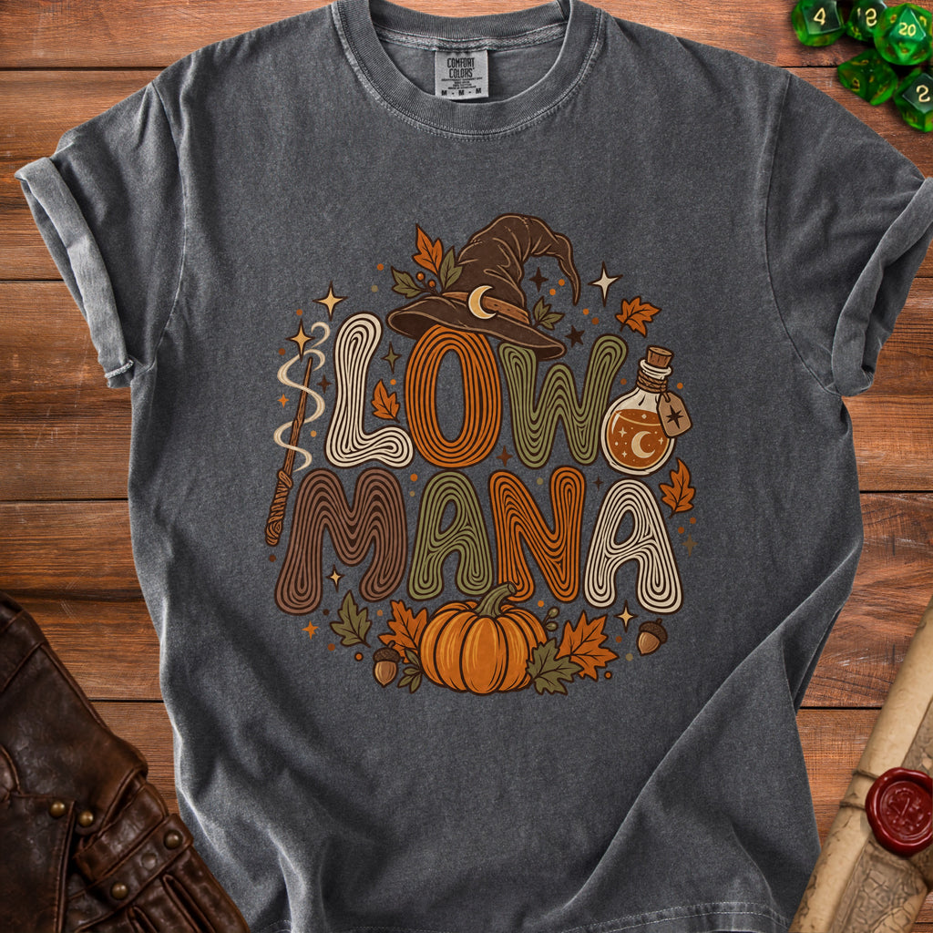 Dark grey t-shirt with "Low Mana" text, witch hat, potion, pumpkin, and leaves.