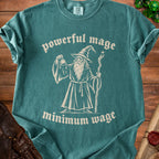 Teal t-shirt with a graphic of a wizard and text "powerful mage minimum wage".
