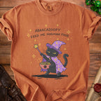 Black cat wizard with wand and spaghetti, text reads "ABRACAZOOPY FEED ME HOOMAN FOOD".
