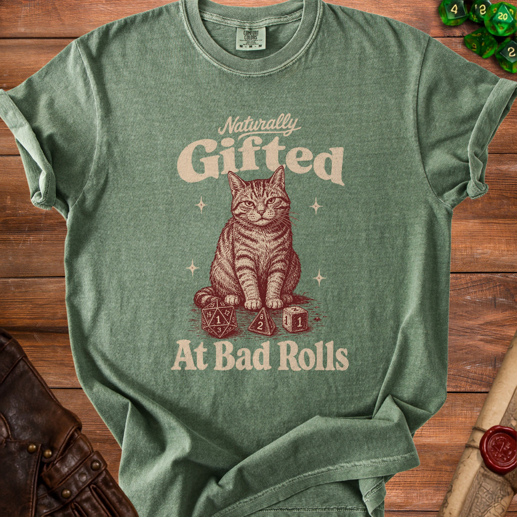 Green t-shirt with cat and dice graphic that reads "Naturally Gifted At Bad Rolls."