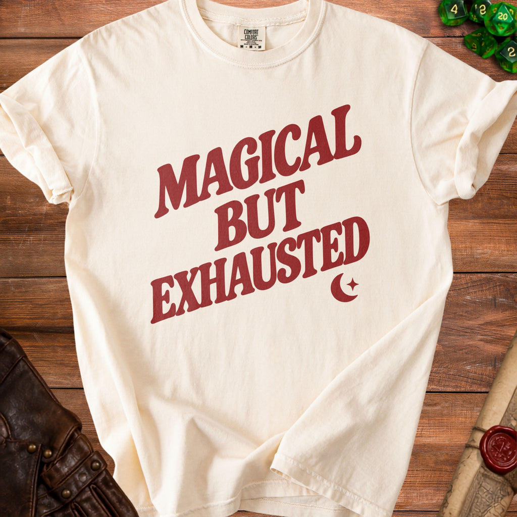 Cream t-shirt with maroon text that says "Magical But Exhausted".