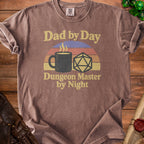 Brown t-shirt with "Dad by Day Dungeon Master by Night" text, coffee mug, and D20 die.