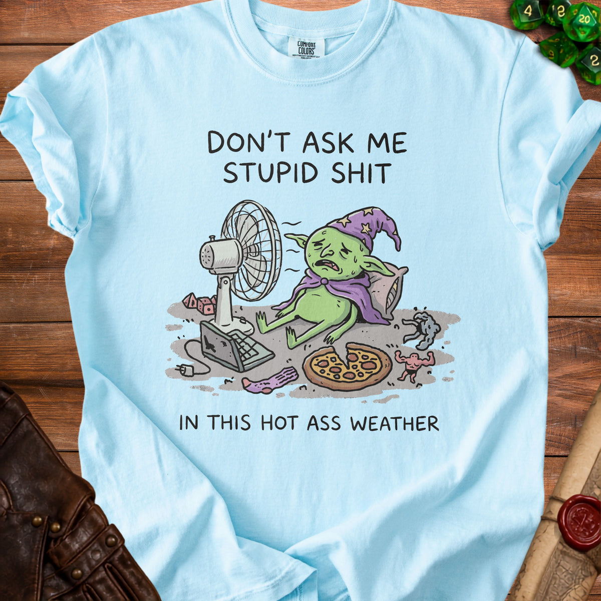 Light blue t-shirt with "Don't Ask Me Stupid Shit In This Hot Ass Weather" and goblin artwork.
