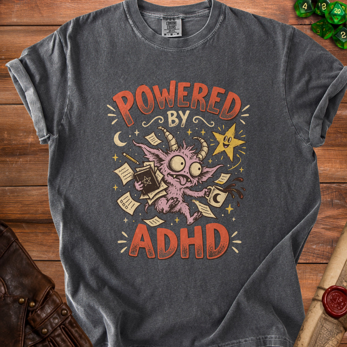 Dark grey t-shirt with "Powered By ADHD" text and a cartoon monster.