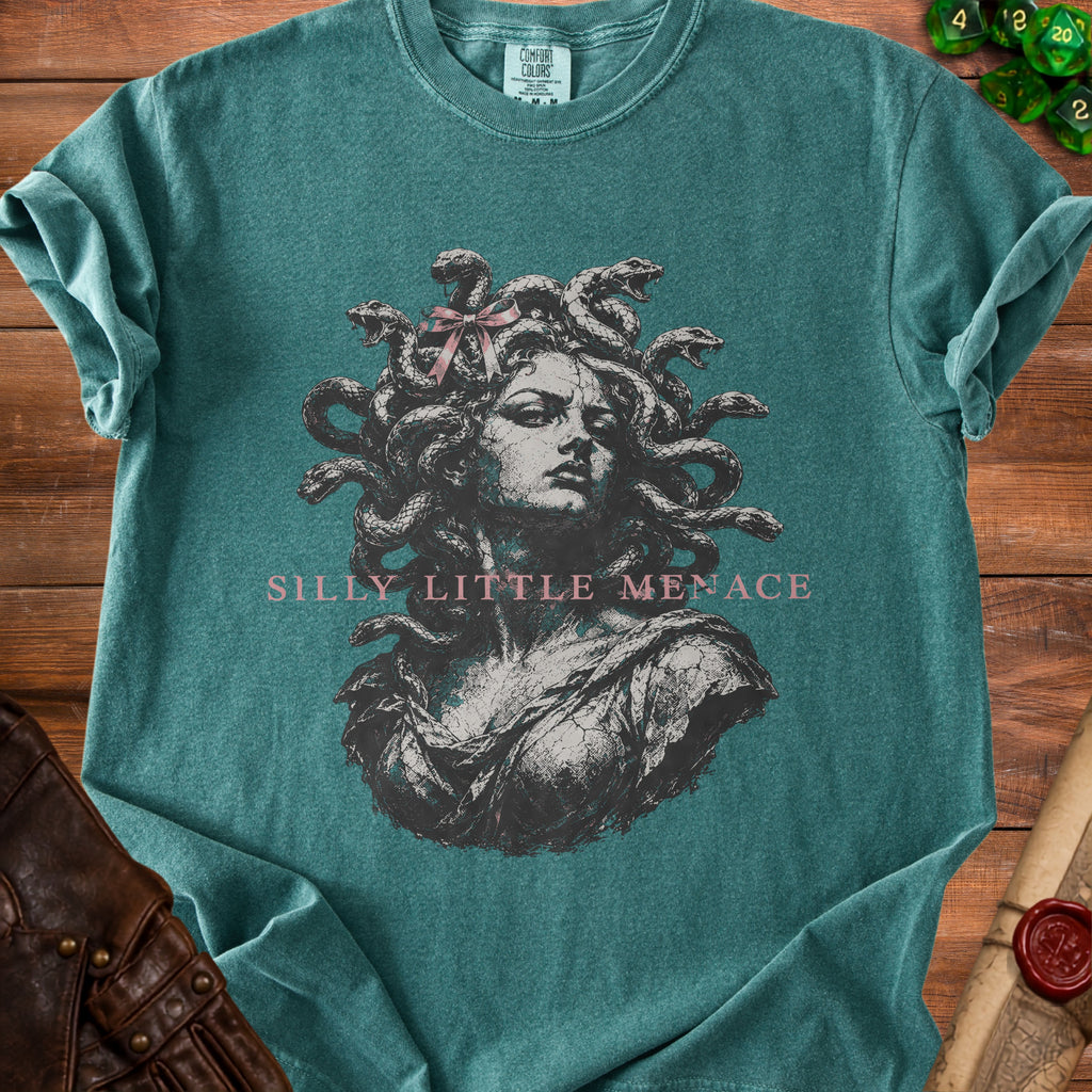 Teal t-shirt with Medusa graphic and "Silly Little Menace" text.