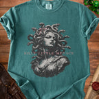 Teal t-shirt with Medusa graphic and "Silly Little Menace" text.