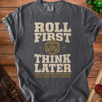 T-shirt with "Roll First Think Later" and dice graphic.