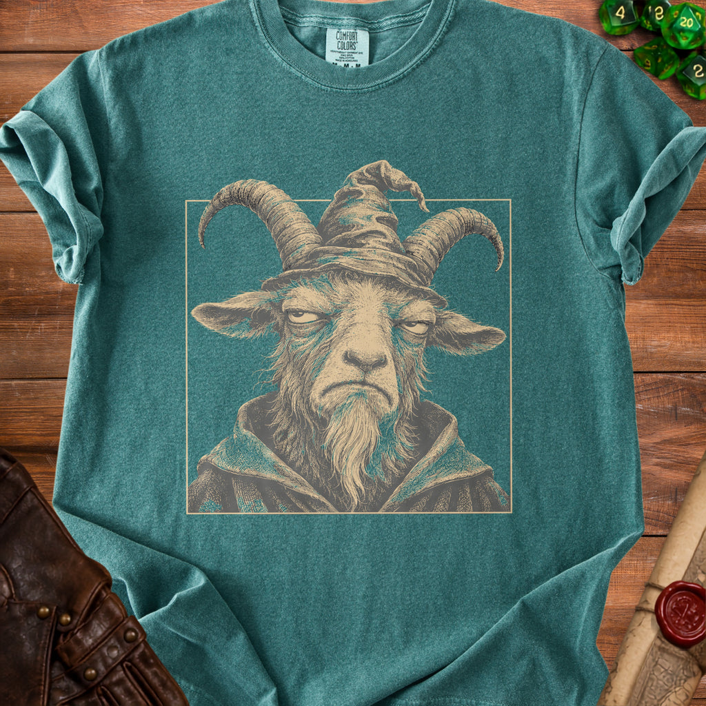 Teal t-shirt with illustration of a goat wearing a wizard hat and robe.